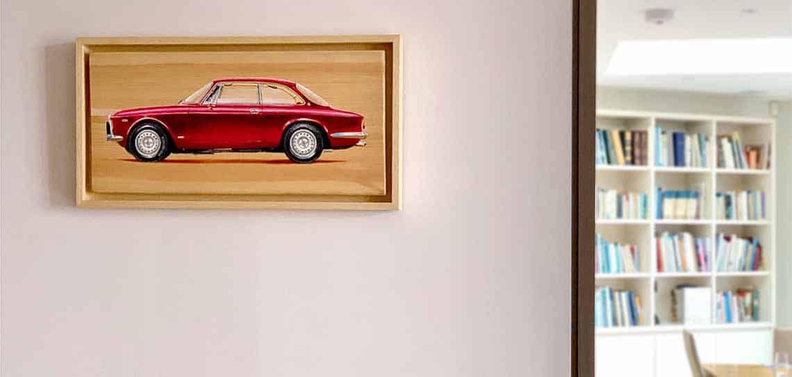 Automotive art: Alfa Romeo painting in bright room interior with library and dining table in background.