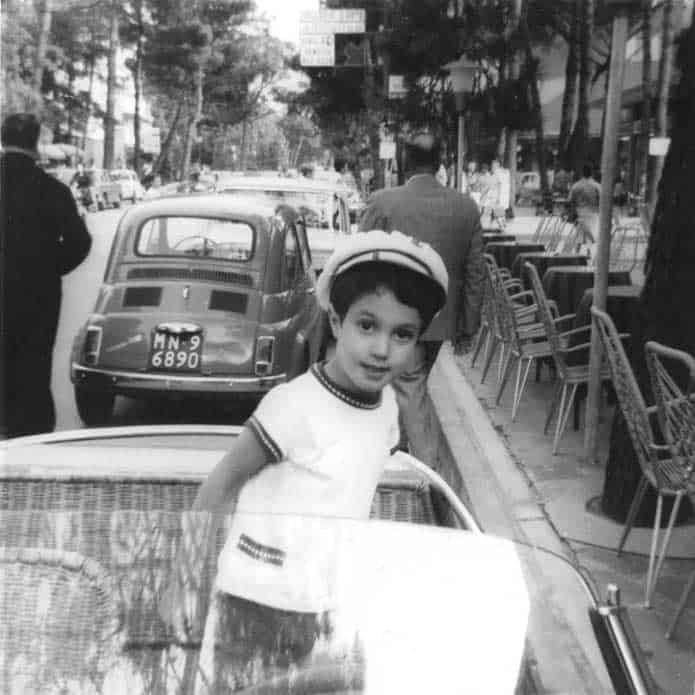 boy sitting in open car in Italy: Darius in a Fiat Jolly